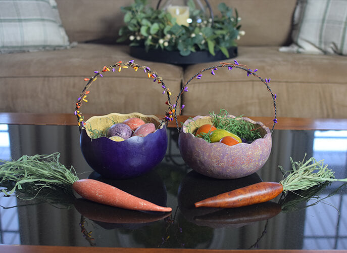 Two basket gourds filled with gourd eggs and two carrot gourds at Meadowbrooke Gourds