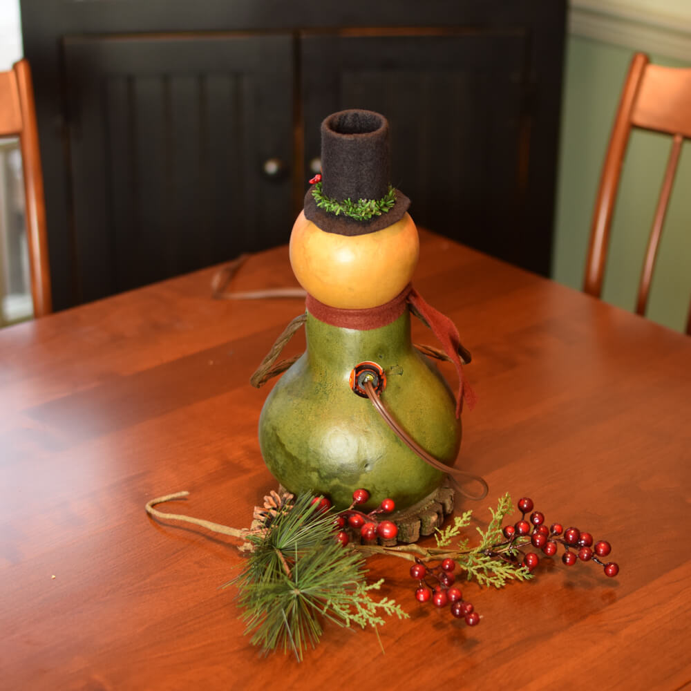 Small Lit Pinewood Snowman Gourd at Meadowbrooke Gourds. Back View